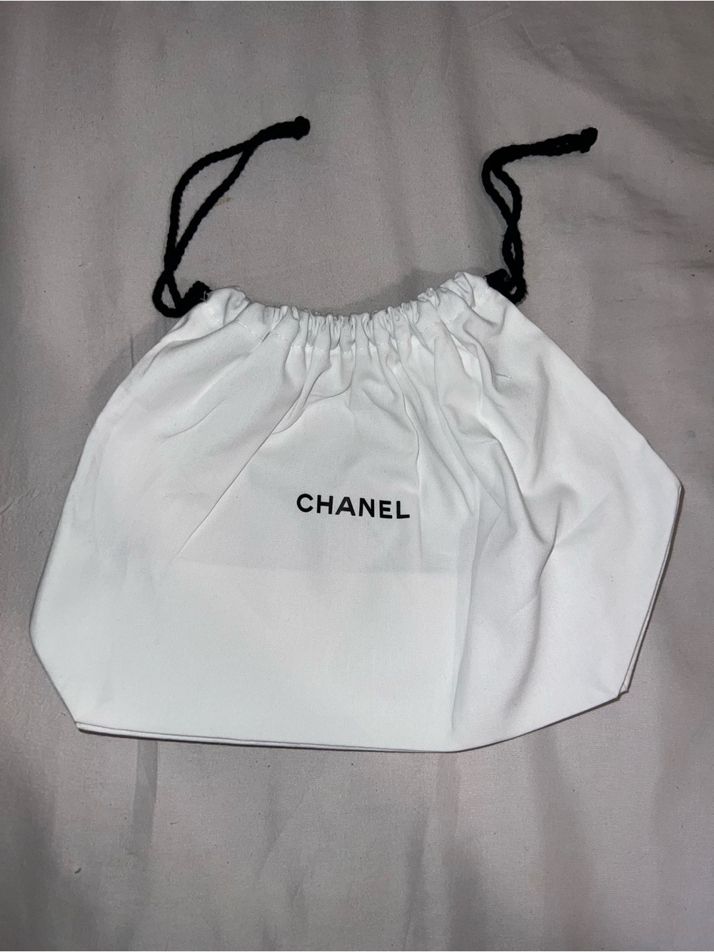 CHANEL White Bag with Black Drawstrings